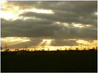 Sun breaking through clouds