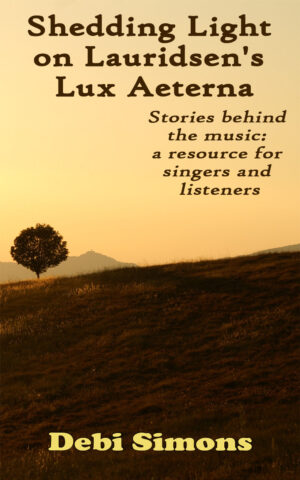 Book cover for Shedding Light on Lauridsen's Lux Aeterna, shows hill, tree, and mountain in dusk or dawn